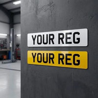 White front and yellow rear 2D number plates side by side