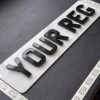 White 4D front number plate with raised gloss black letters